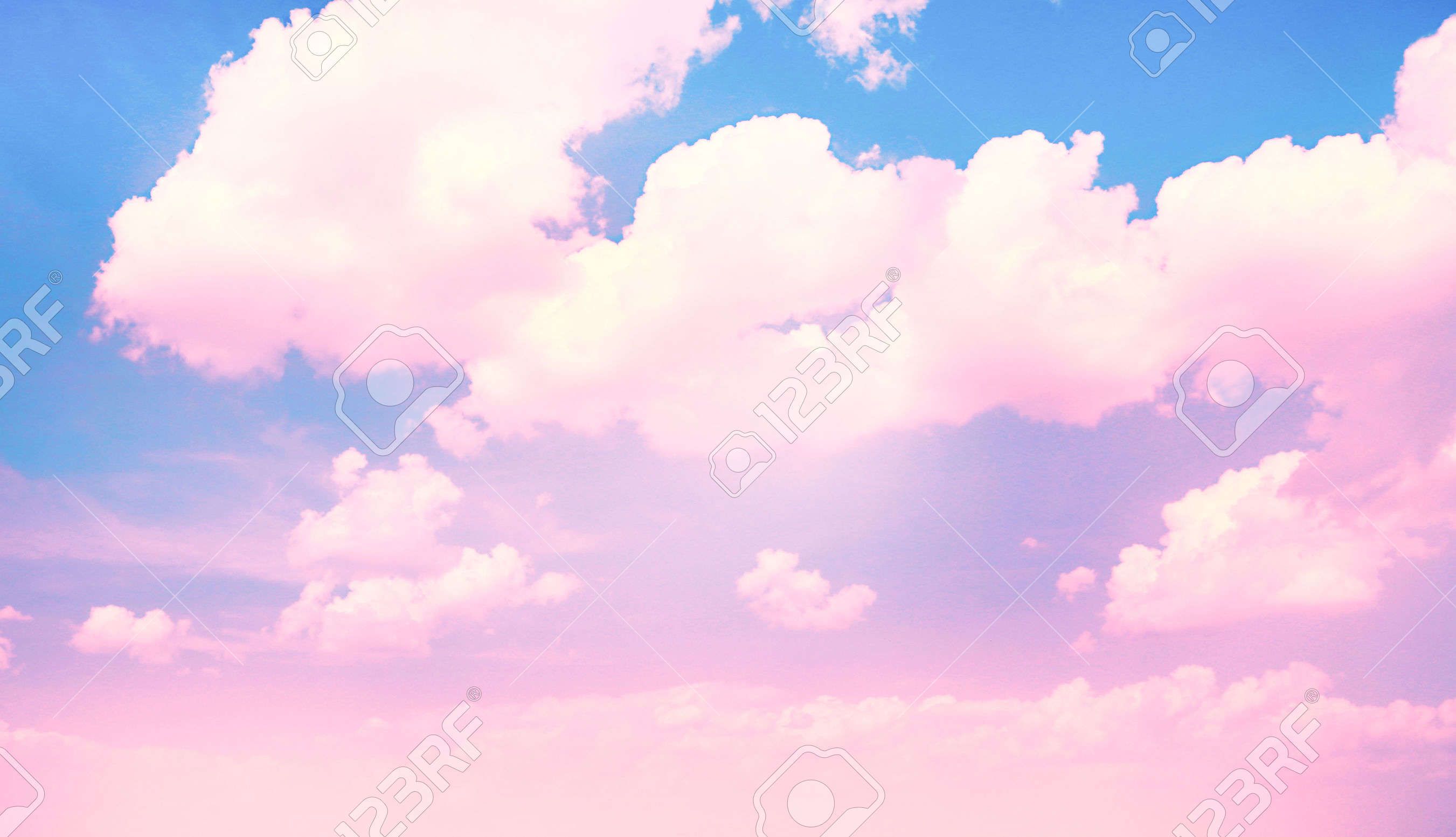Blue Sky Background With Pink Clouds Stock Photo Picture And Wallpaper