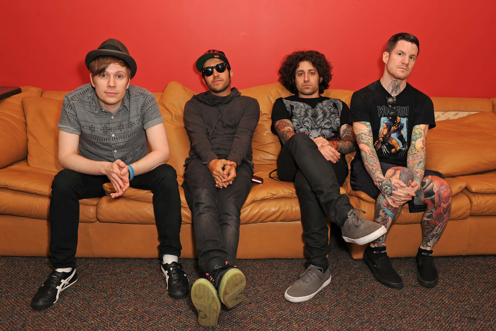 Fall Out Boy band members sitting on a couch