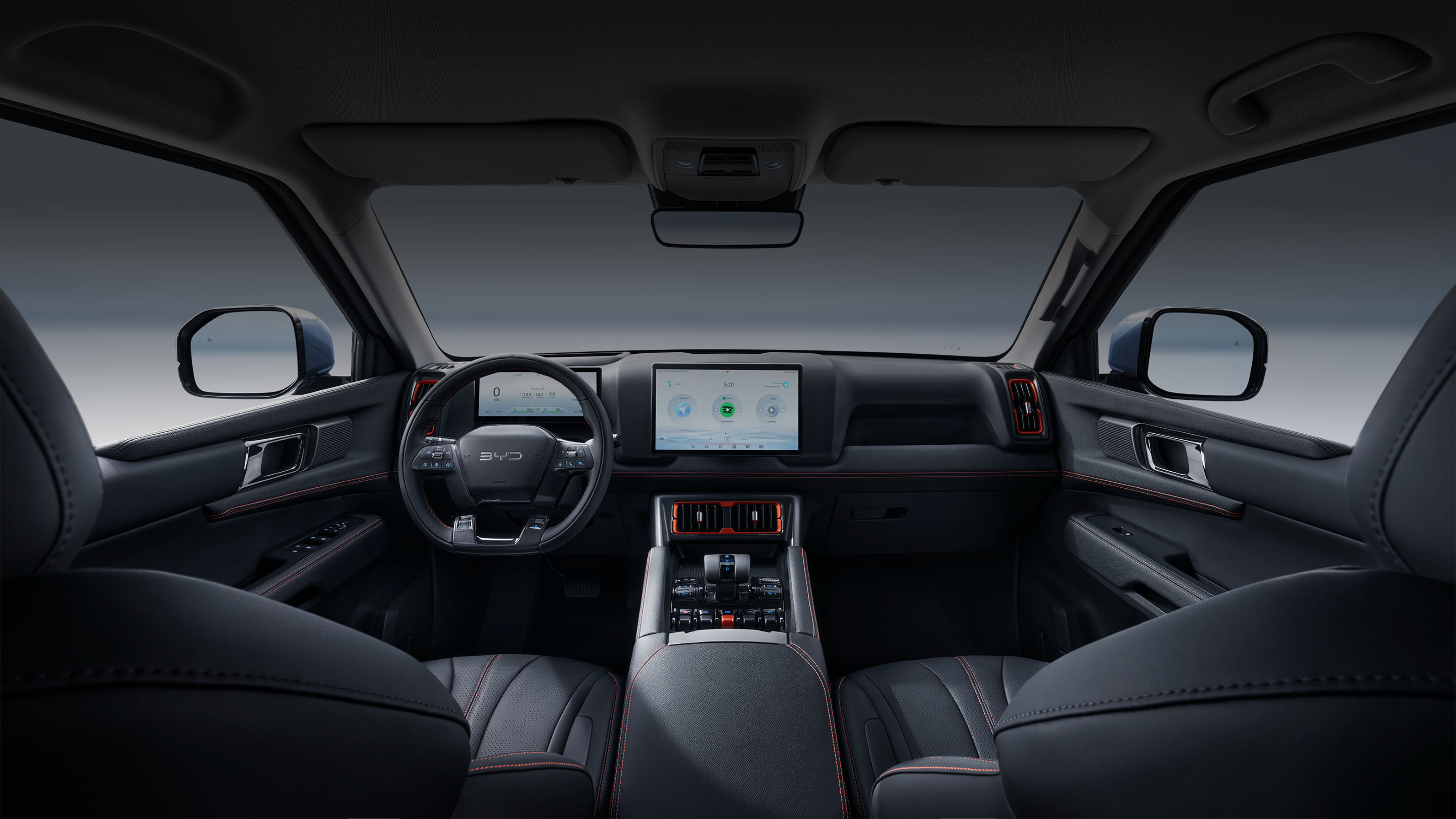 Interior view of a BYD Shark, showcasing its modern dashboard, infotainment system, and leather seats