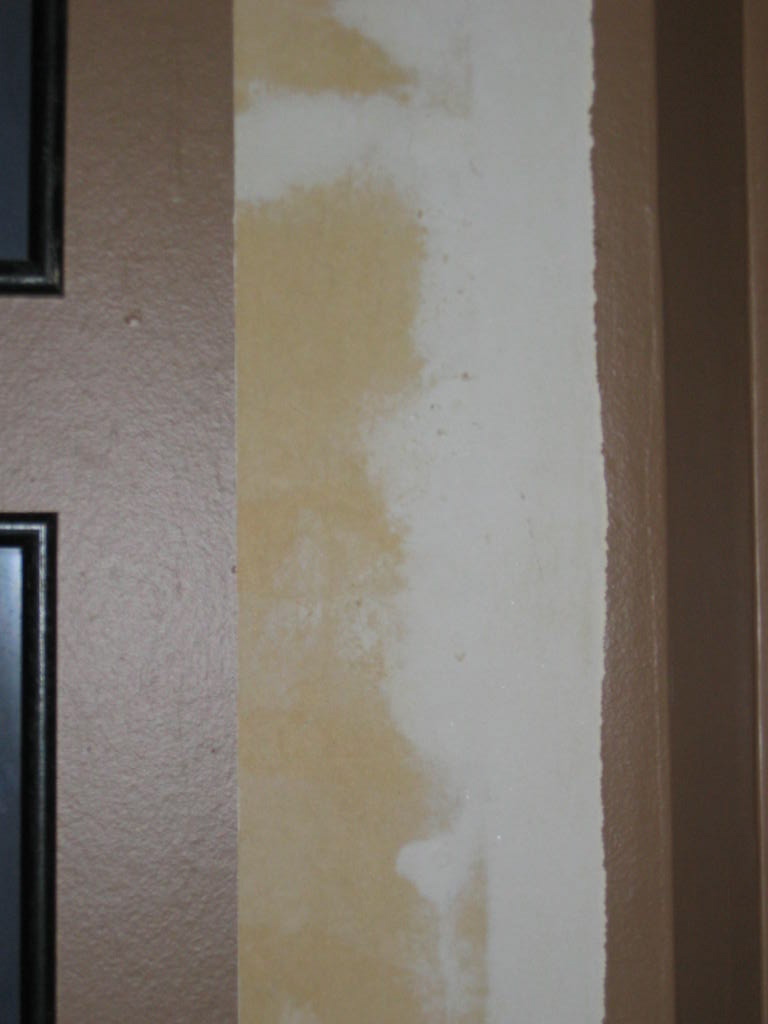 Free download close up of bare drywall rolled up strip of painted