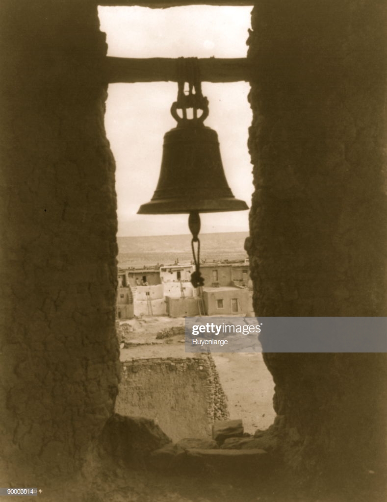 Bell In Opening Wall Pueblo Buildings Background News