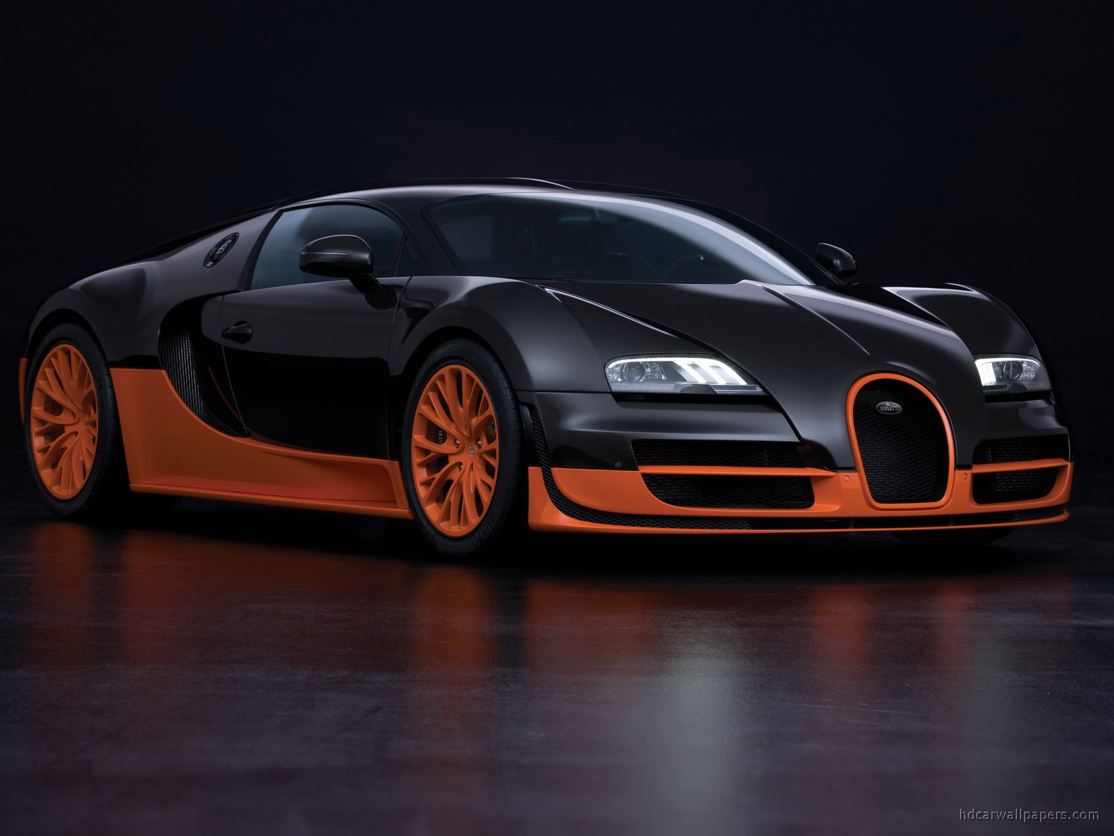 Sleek Black and Orange Bugatti Veyron on Dark Background