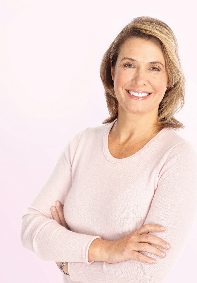 Smiling Happy Mature Woman Over Pink Background