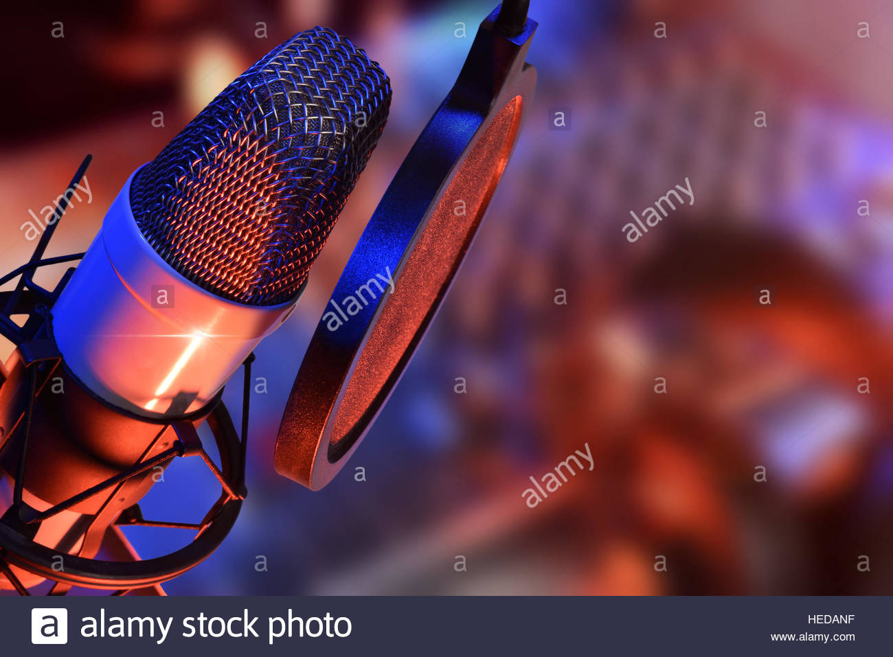 Studio Microphone With Headphones And Mixer Background Blue