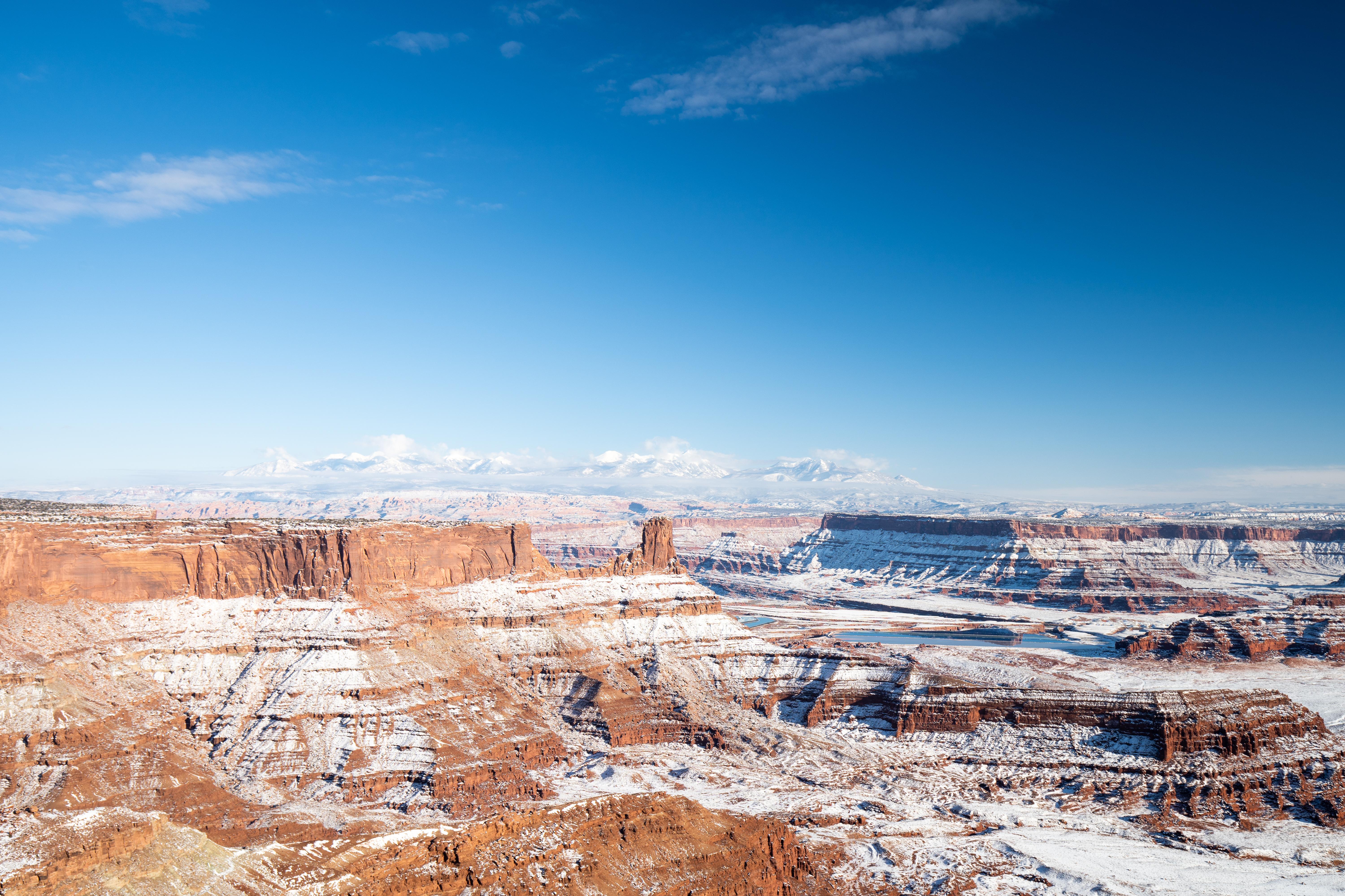 Snow Covered Canyons Near Moab Ut With La Sal Mountains In The