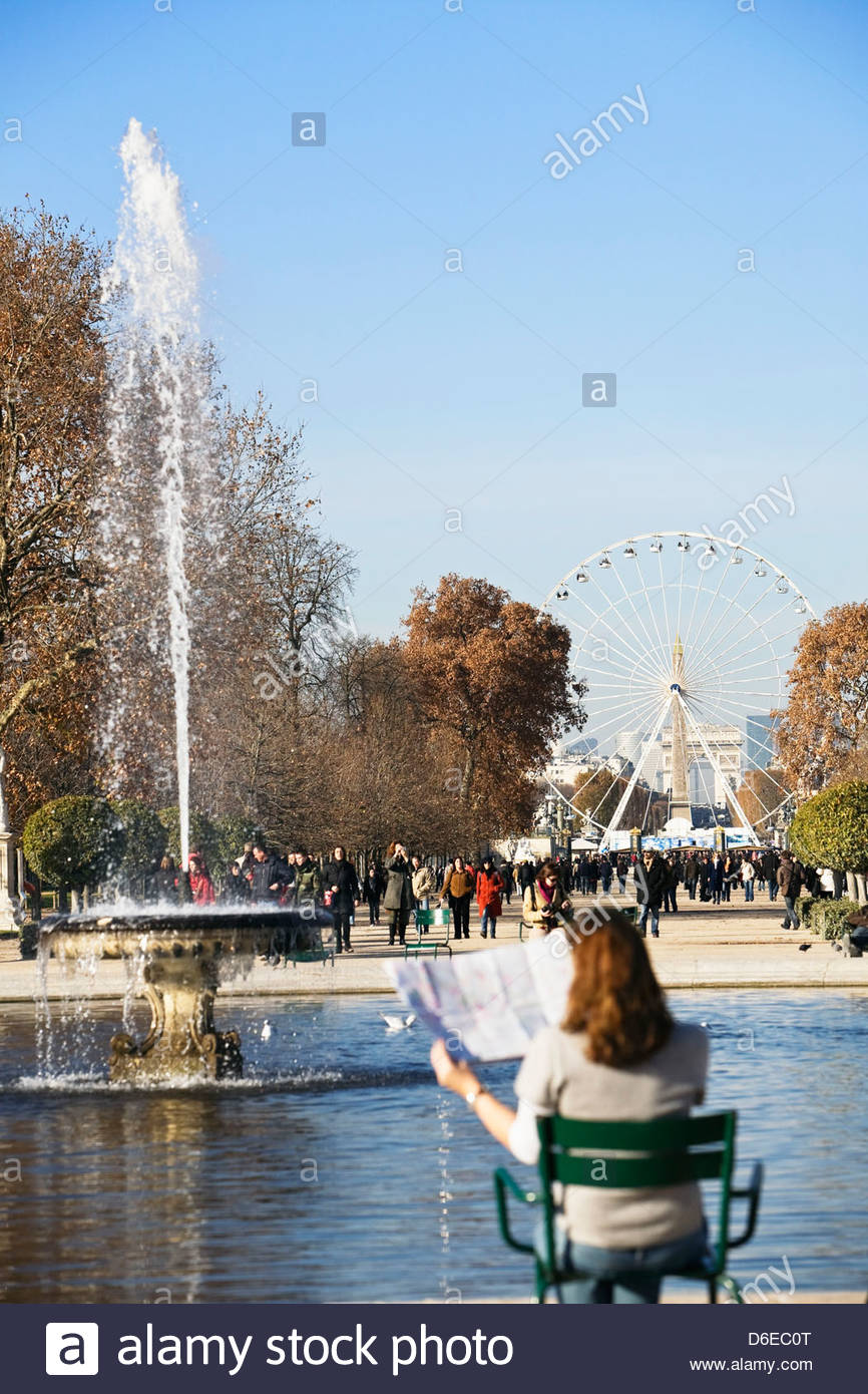 Woman Looking Map With Place De La Concorde Big Wheel In
