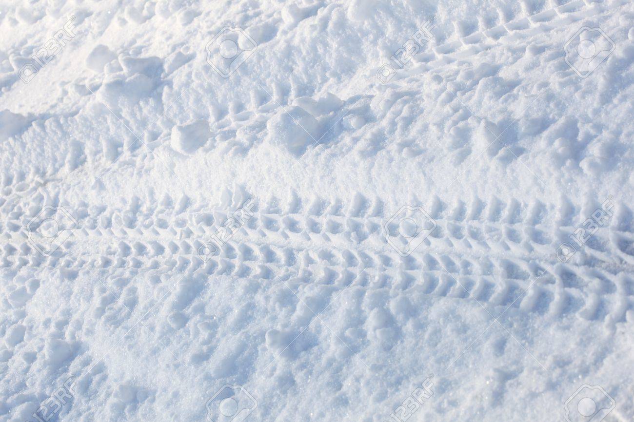Snow On Driveway With Tire Track For Winter Background Stock Photo