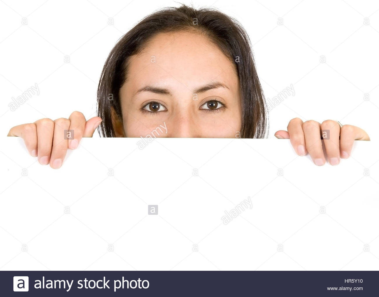 Young Girl Peeping Over A White Banner Whte Background