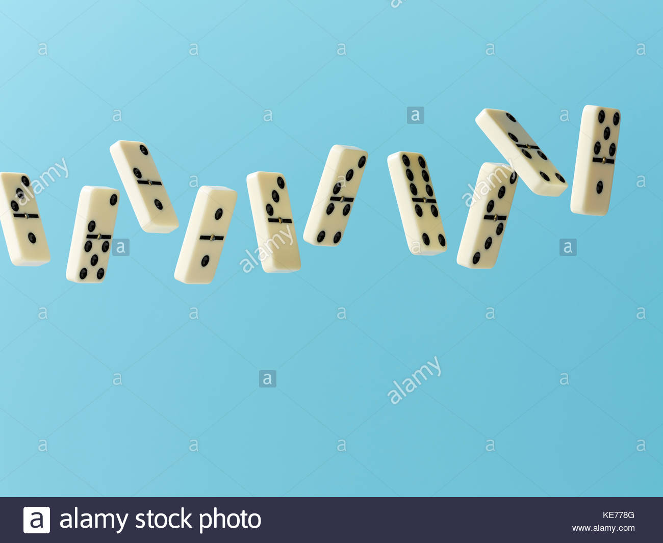 Floating dominos on blue background Stock Photo 163657888   Alamy