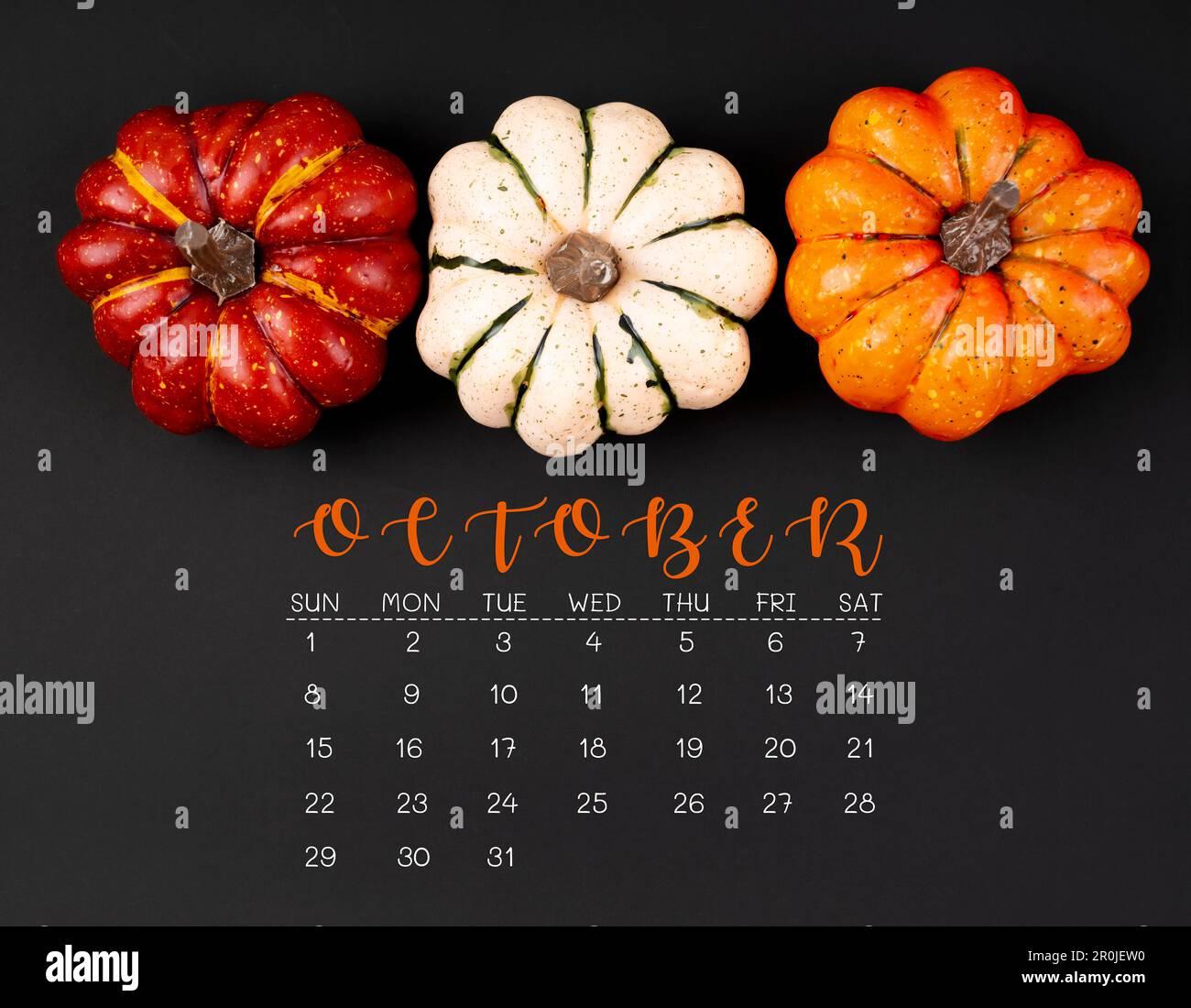 October Calendar And Pumpkins On Black Color Background Stock