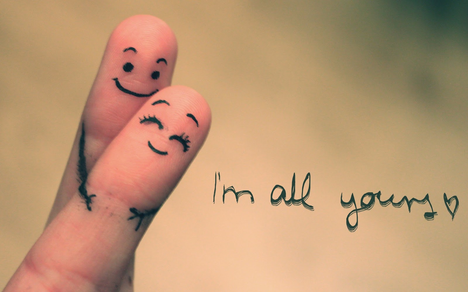 Two fingers with drawn faces embracing, symbolizing love and affection. The text 'I'm all yours' adds a romantic touch