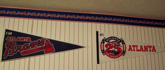 Covered In A Red And White Pinstripe Wallpaper With Braves Border