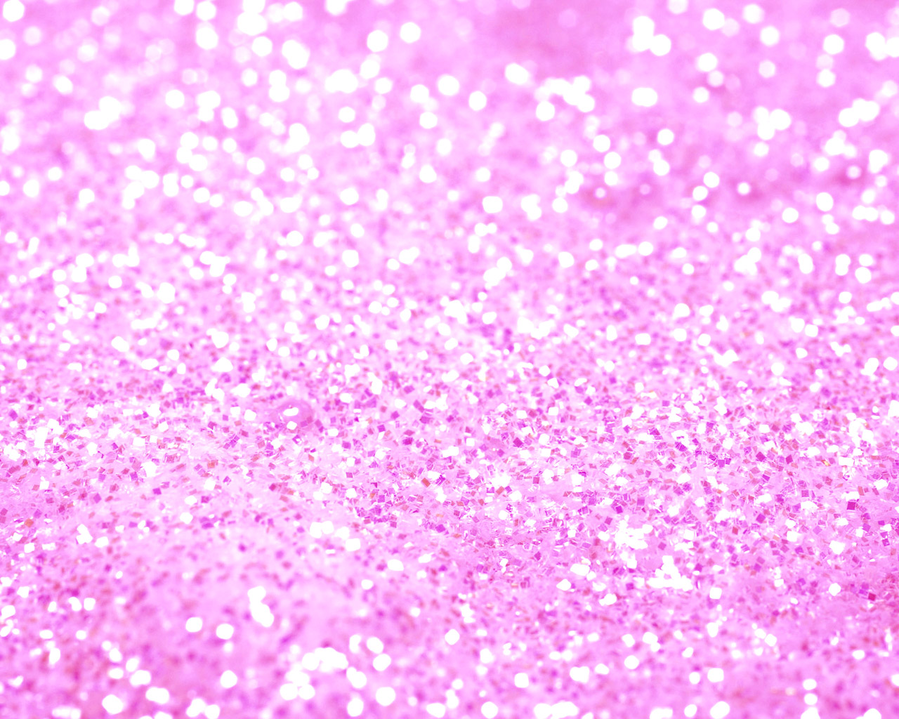 A close-up image of shimmering pink glitter, creating a dazzling and textured background