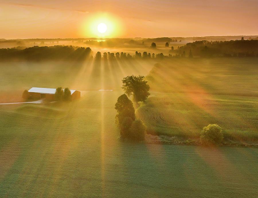 Late Summer Sunrise Over Misty Rural Landscape With Long Shadows
