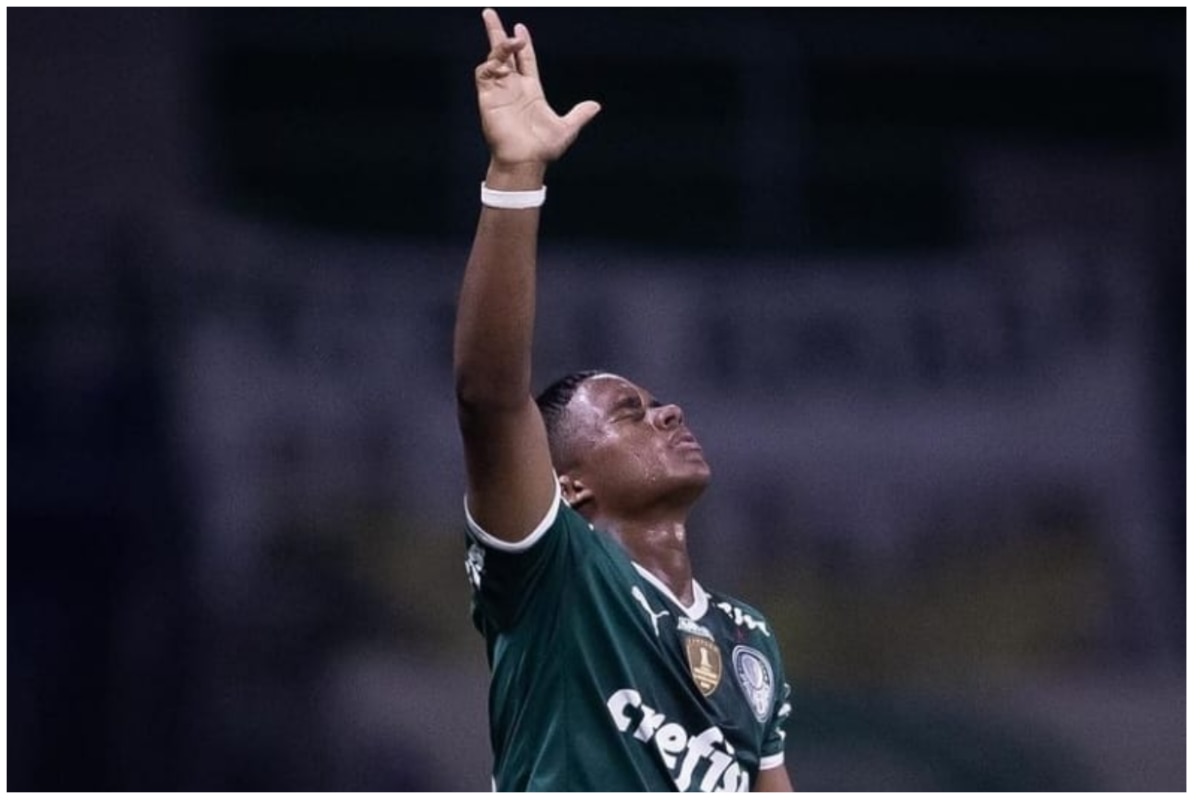 Endrick Felipe celebrating a goal with his arm raised and looking up to the sky