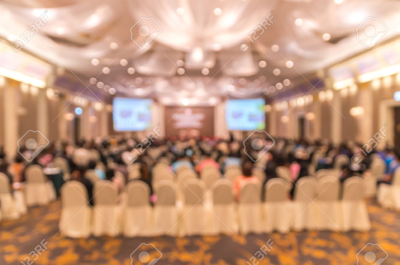 Abstract Blurred Photo Of Conference Hall Or Seminar Room With