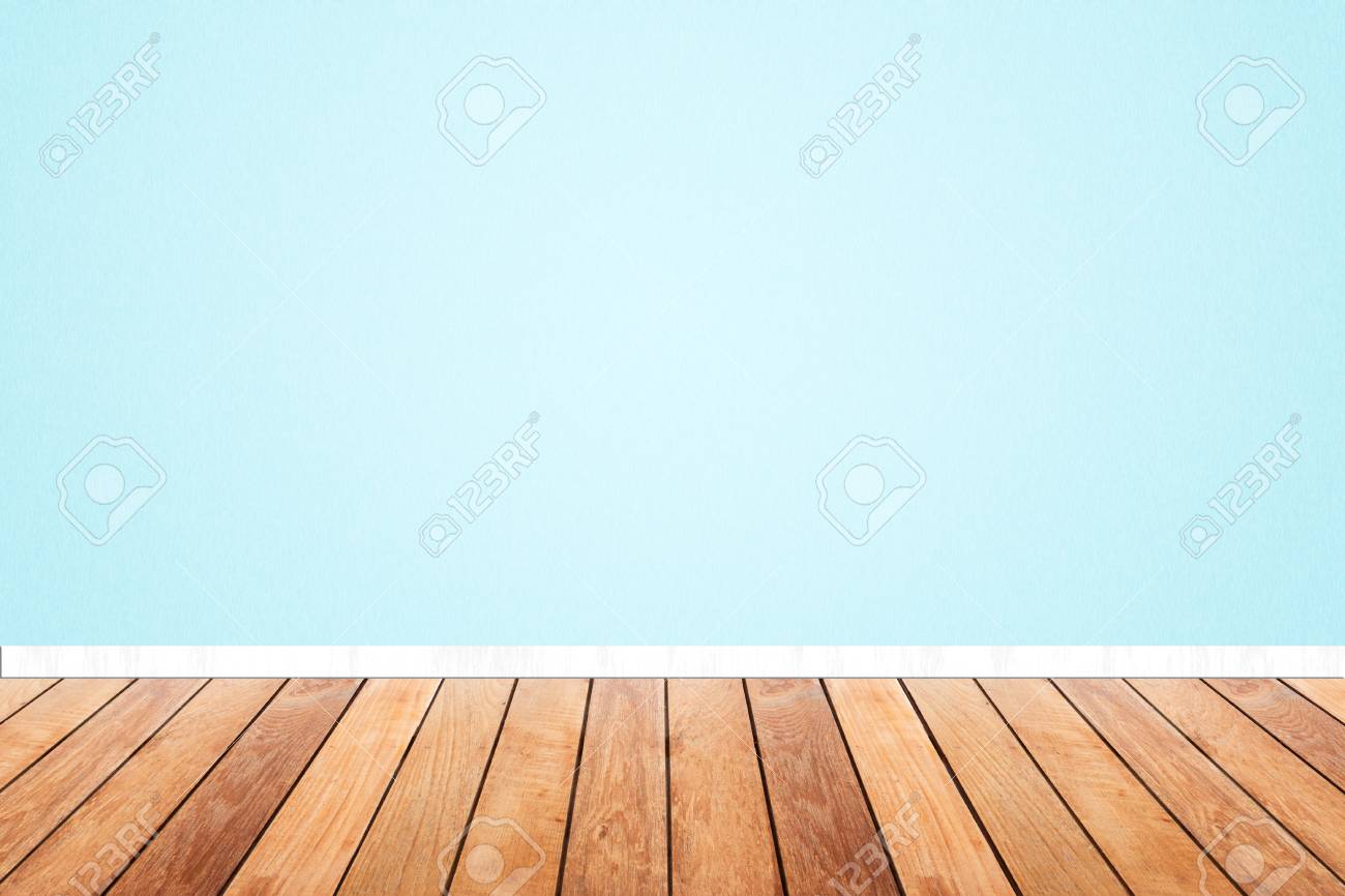 Wood Floor And Light Blue Pastel Wallpaper Interior Stock Photo