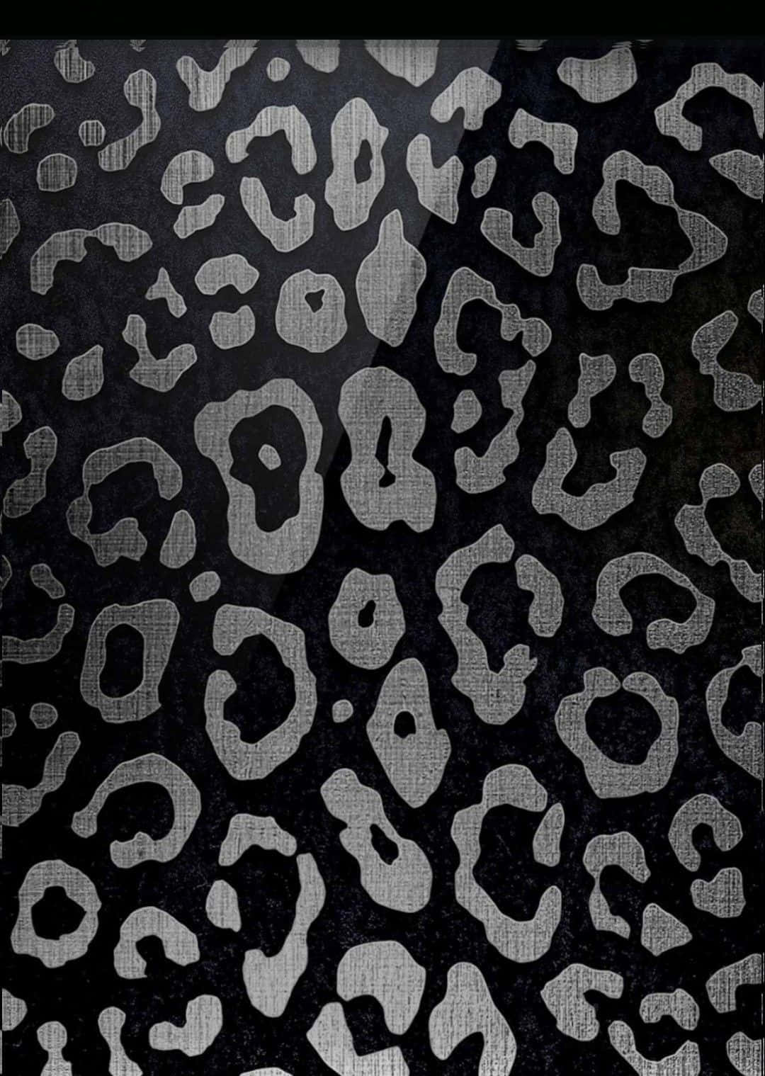 A close-up of a glitter leopard print wallpaper, showcasing the intricate black and silver pattern with a subtle sheen