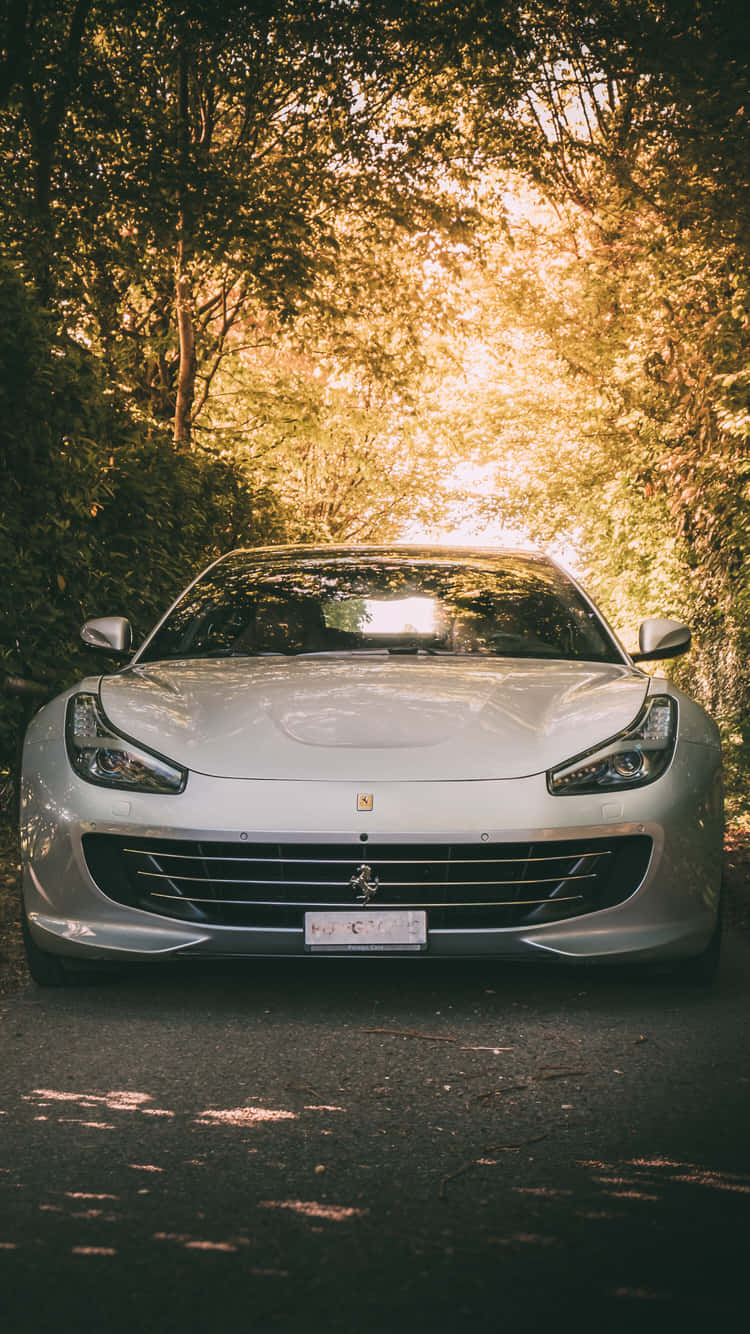 Enjoy The Luxury Of A White Ferrari iPhone Wallpaper
