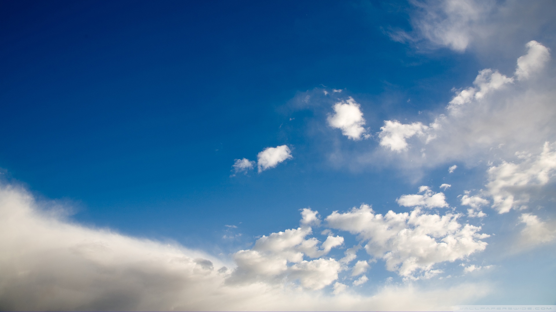 Deep Blue Sky With White Clouds Wallpaper
