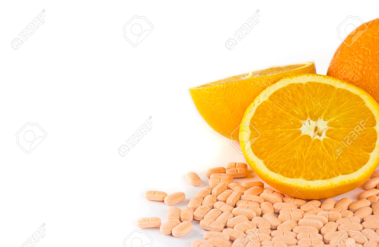 Orange Fruit With Vitamin C Tablet On White Background Stock Photo