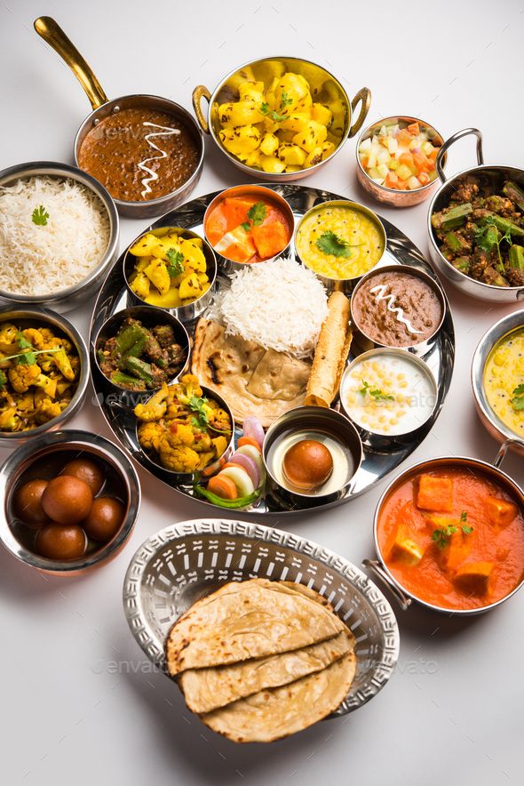 Indian assorted vegetarian food in plate and serving bowls