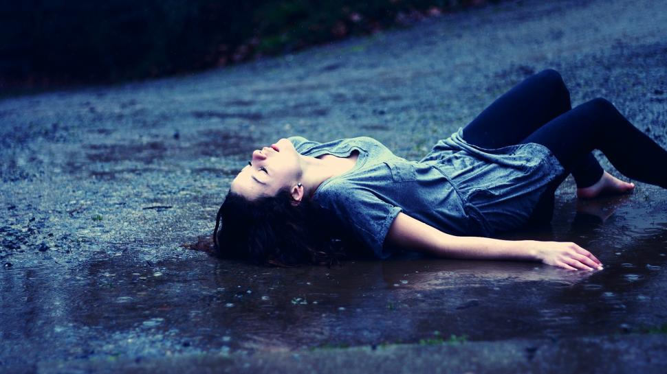 Young Girl Lying In The Rain Wallpaper