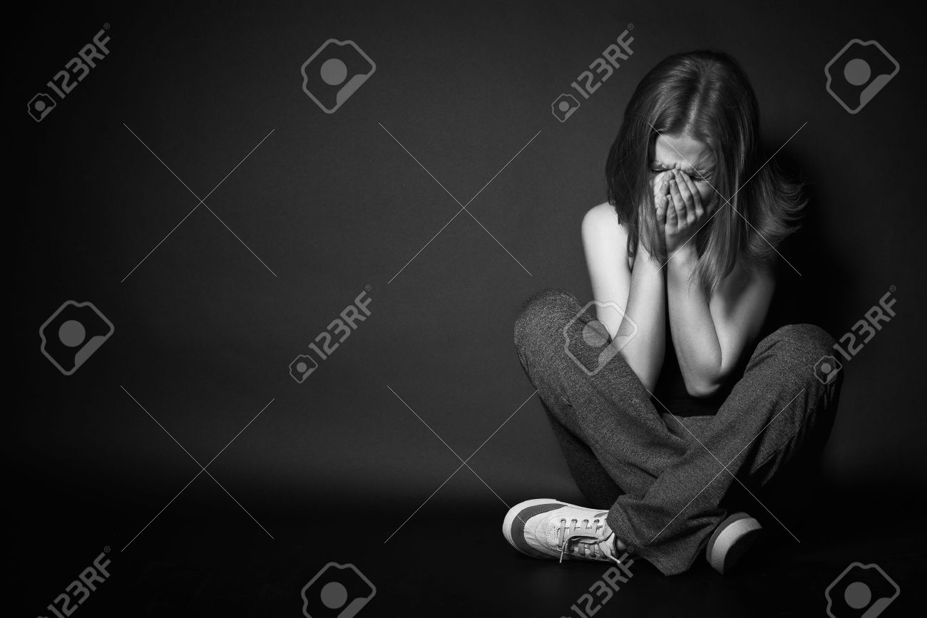 Sad Woman In Depression And Despair Crying On Black Dark