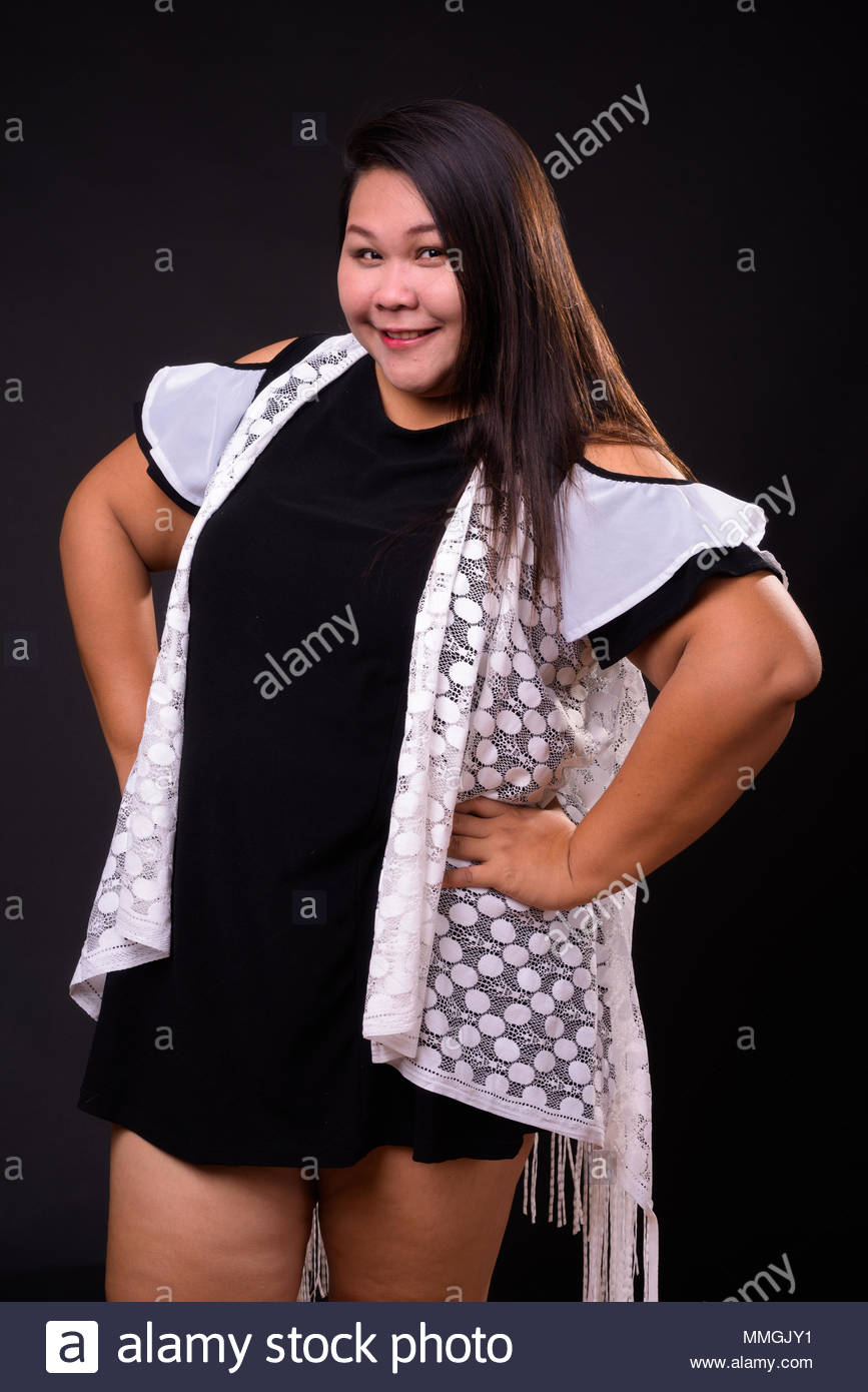 Beautiful Overweight Asian Woman Against Black Background Stock