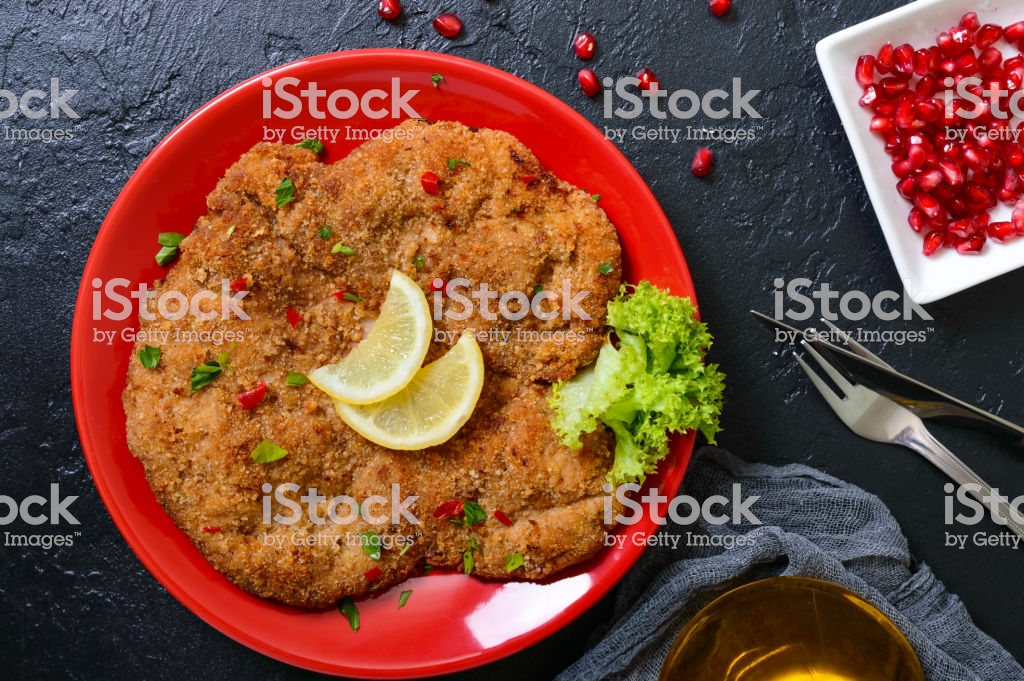 Free download Large Viennese Schnitzel On A Red Plate With Lemon On A