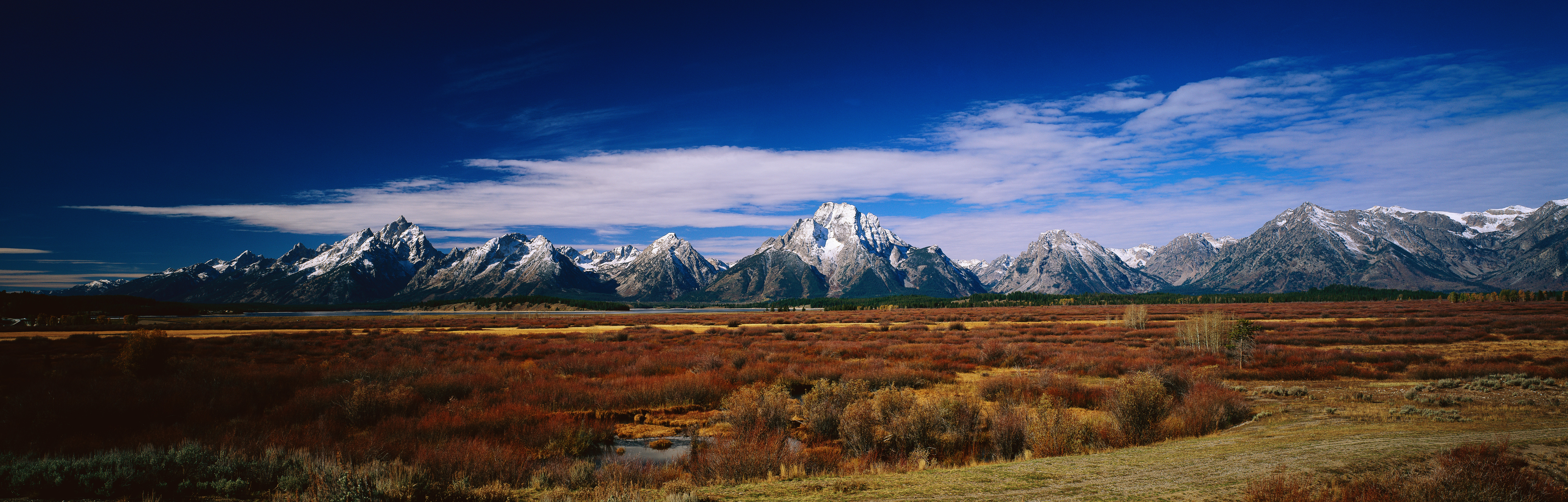 Jackson Hole lies in the heart of Wyoming cowboy country between the