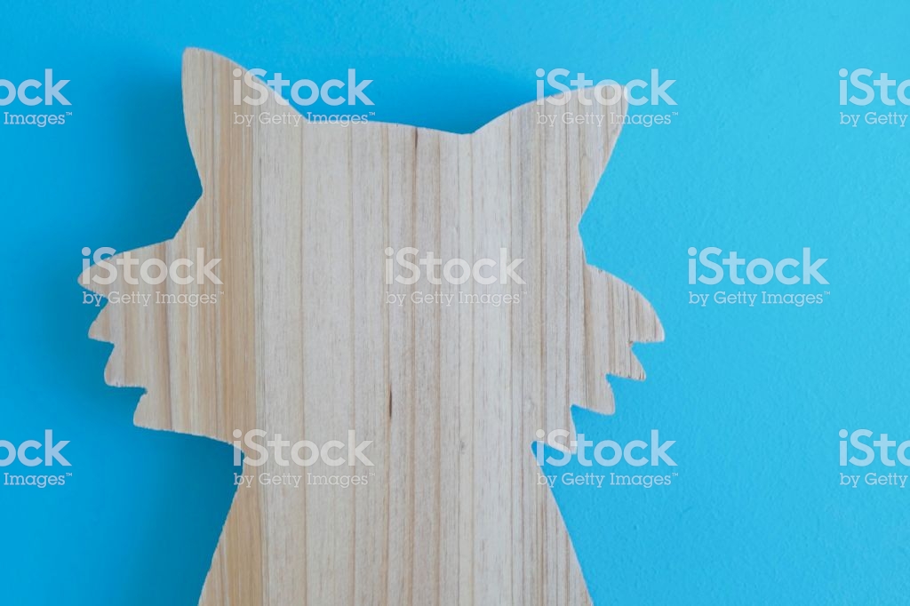 Wooden Fox Head On Blue Background Fretwork Stock Photo