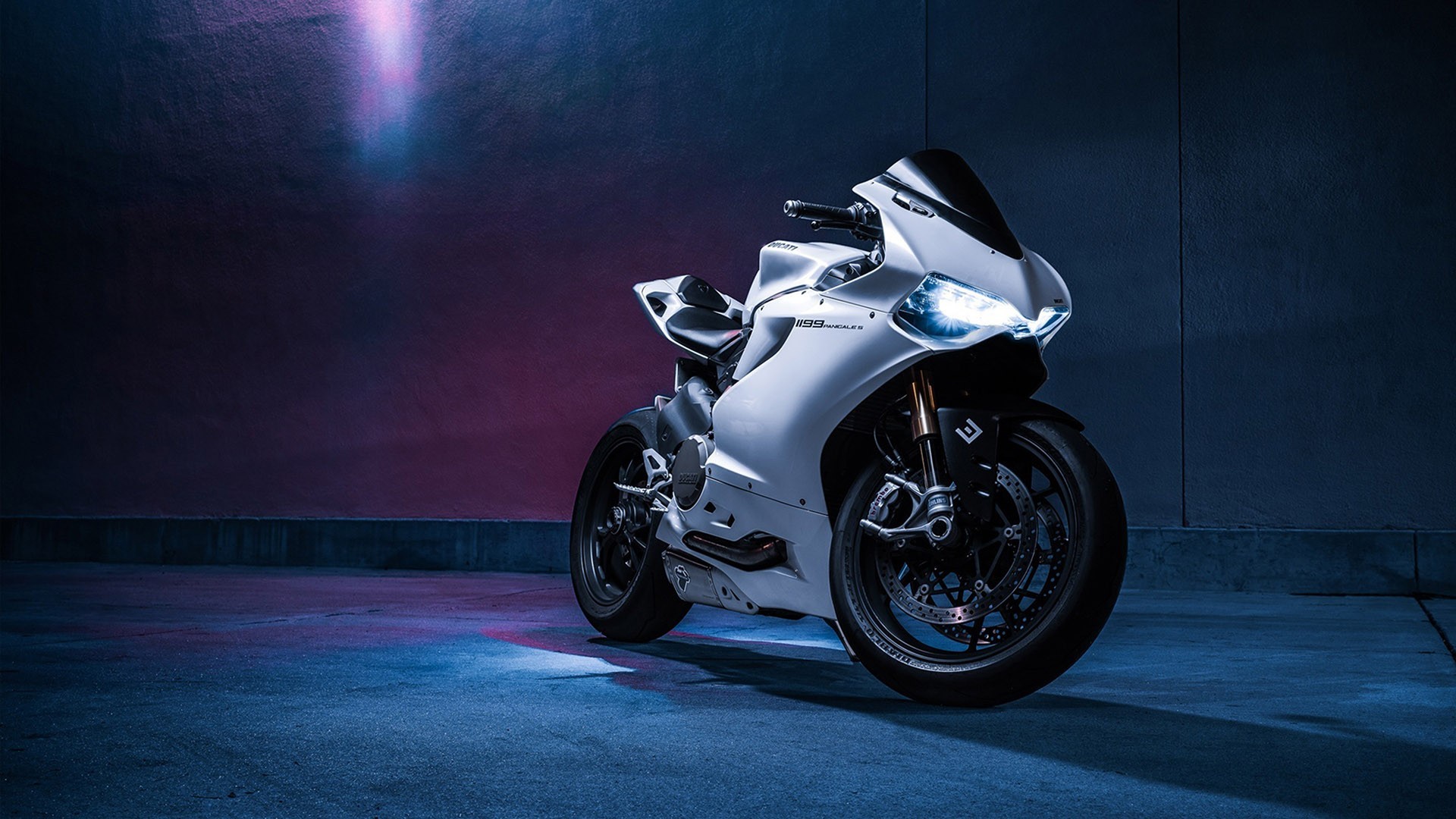 White Ducati 1299 Panigale S Sports Bike parked in dimly lit area