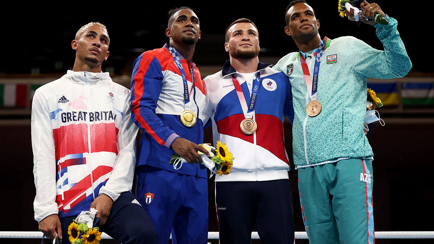Benjamin Whittaker poses with his silver medal at the Olympics