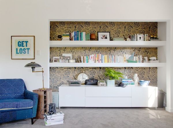 Oh Joy wallpaper in black gold behind this shelving area Styled by 600x444