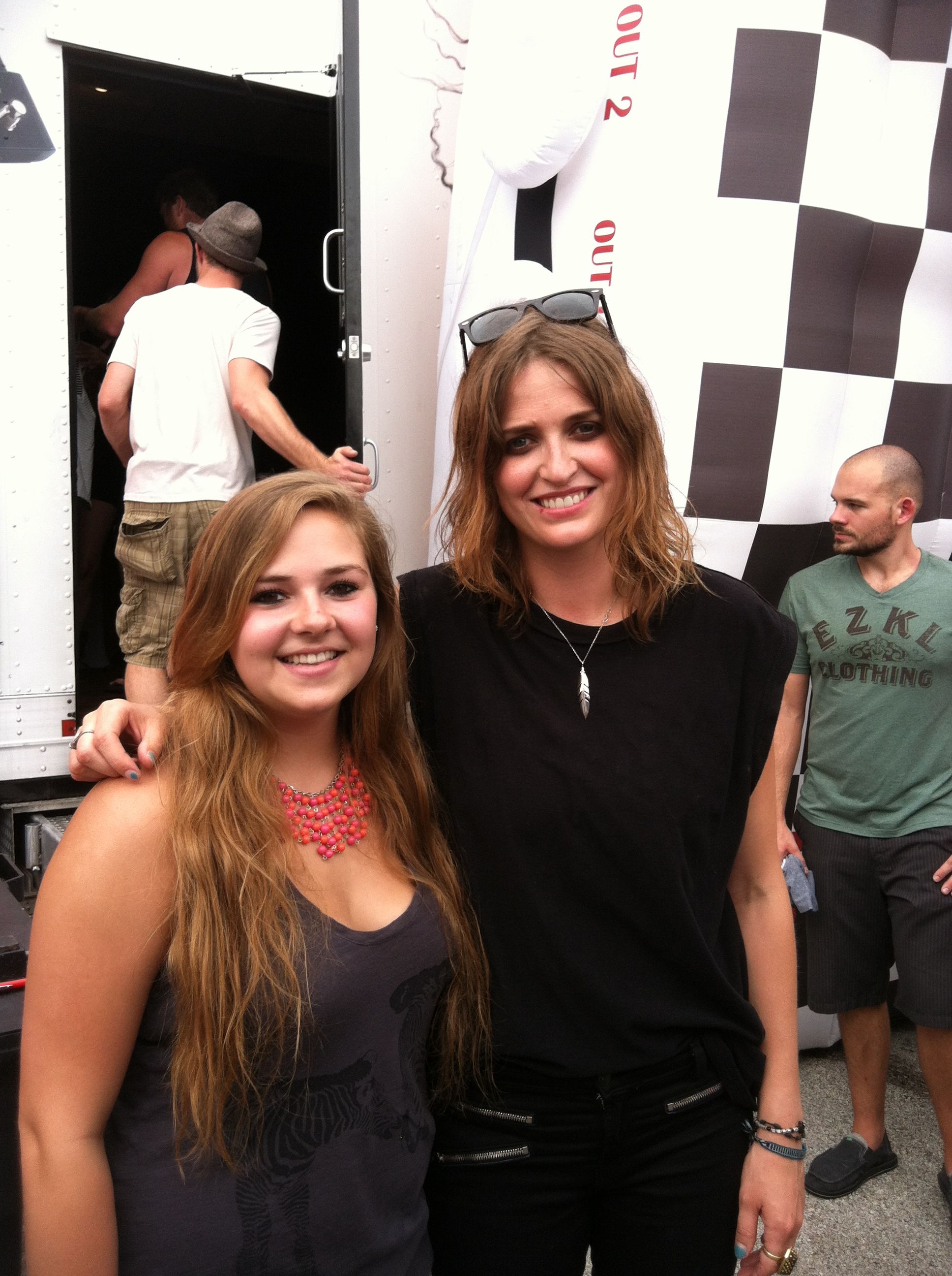 Emily Armstrong of Dead Sara poses with a fan backstage