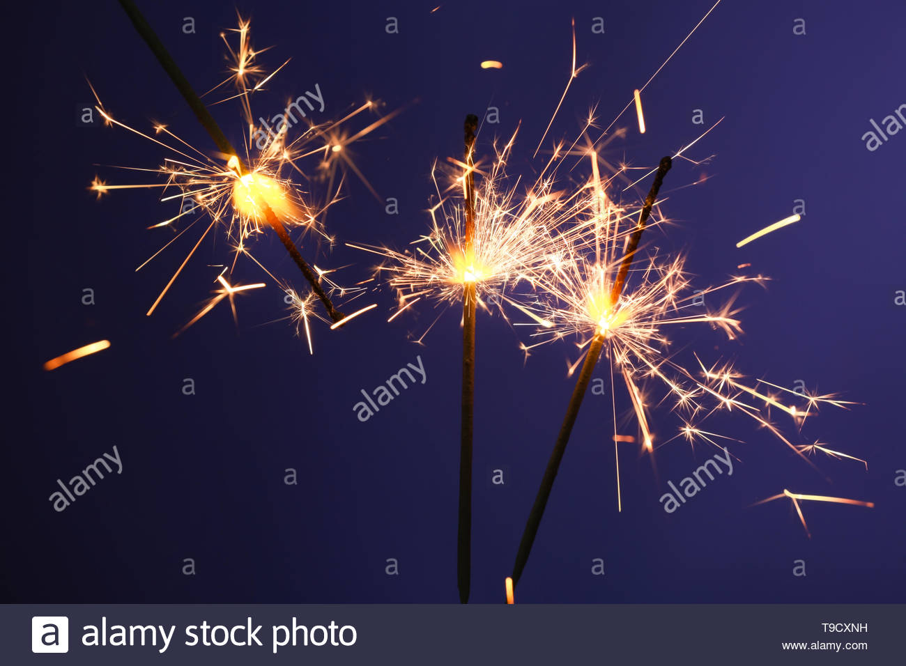 Free download Festive Christmas sparklers on color background Stock