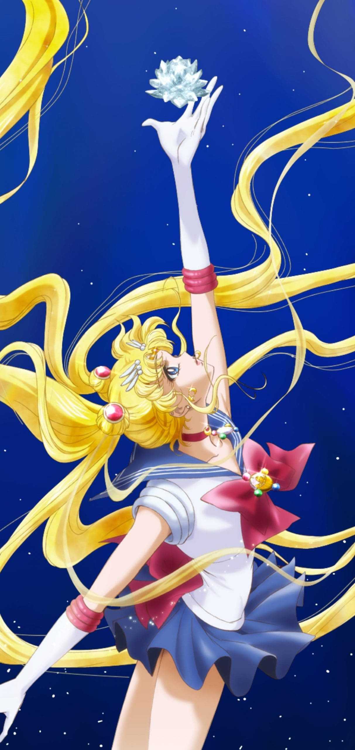 Sailor Moon reaching for the Silver Crystal against a starry night sky