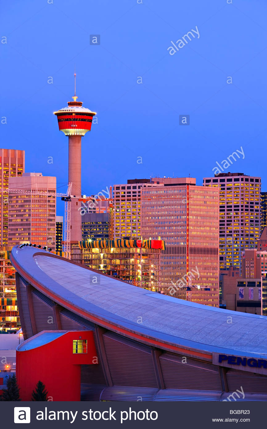 The Saddledome with high rise buildings and the Calgary Tower in