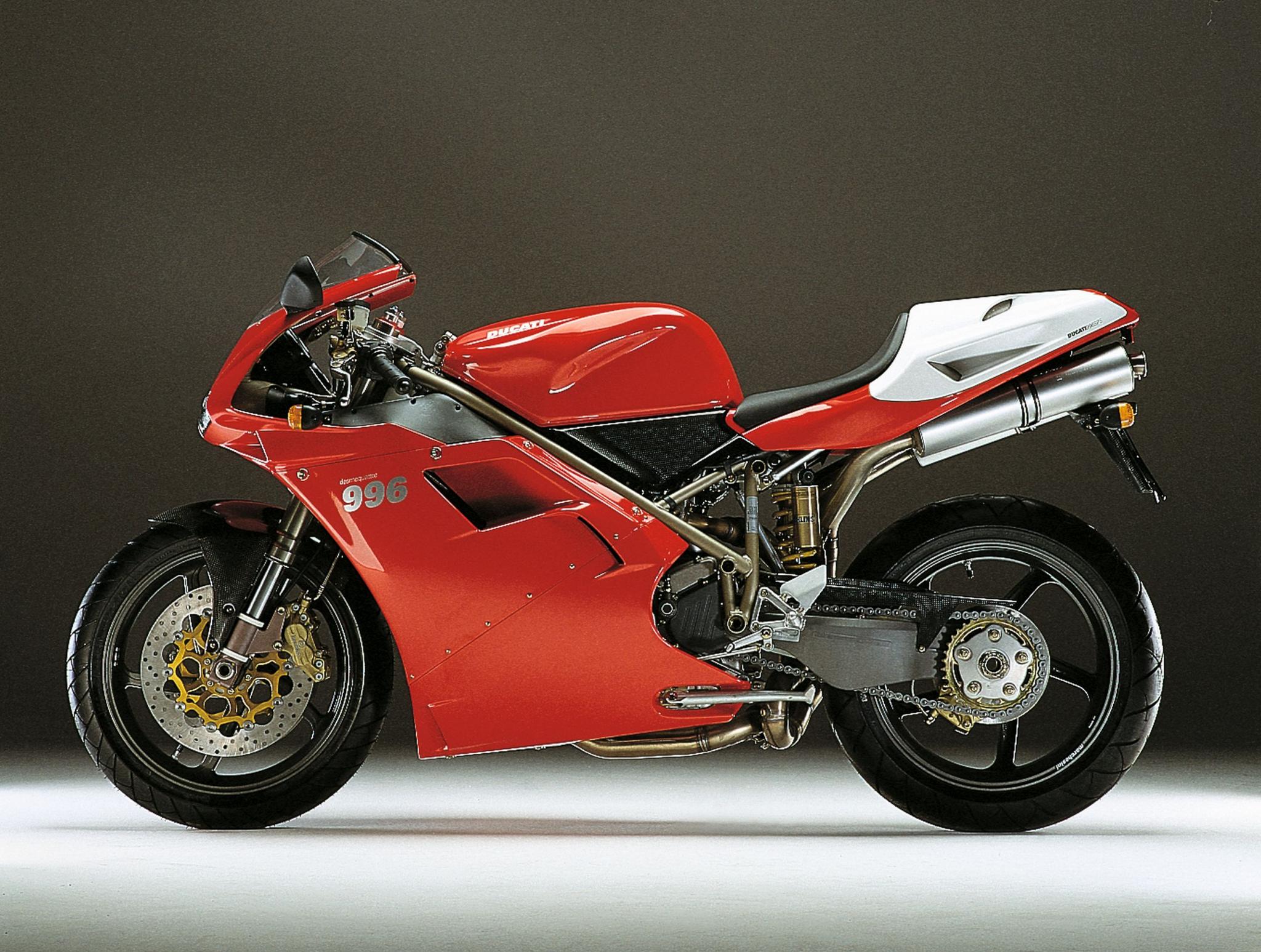Ducati 996 sportbike in iconic red and white livery against a dark background