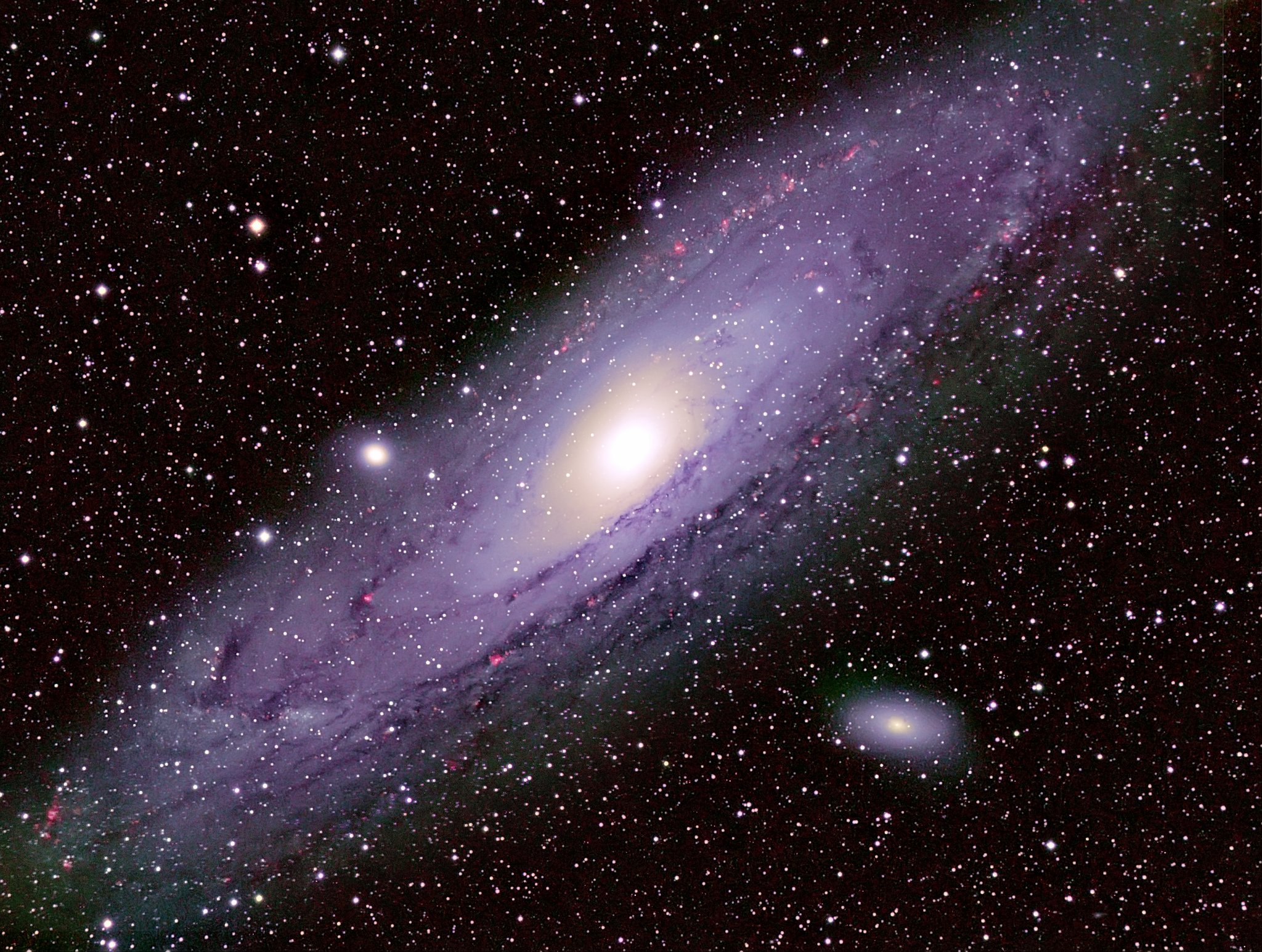 A stunning image of the Andromeda Galaxy, showcasing its spiral arms, dust lanes, and bright core against a backdrop of distant stars