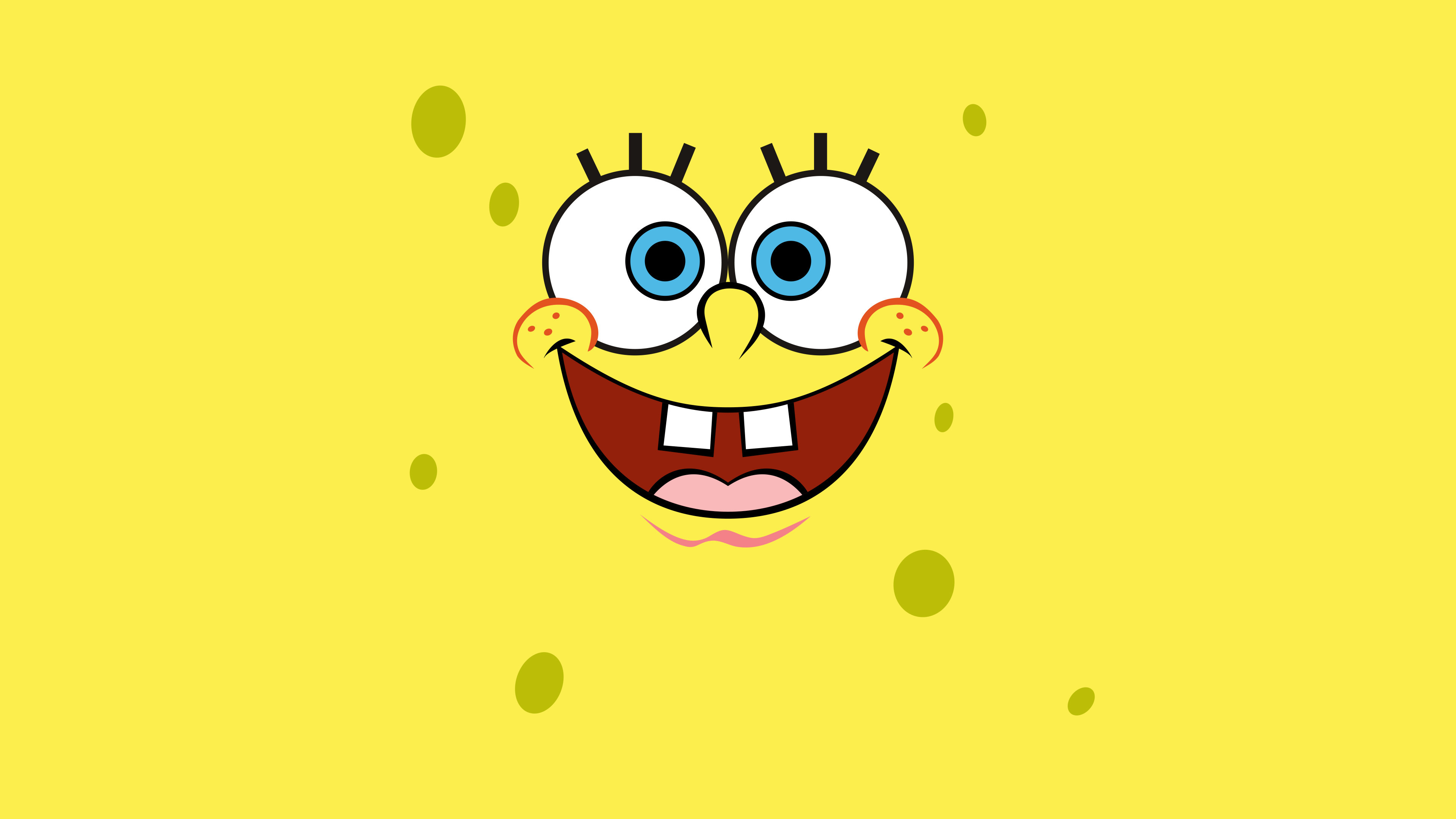 Close-up of Spongebob Squarepants's face with a big smile on a yellow background