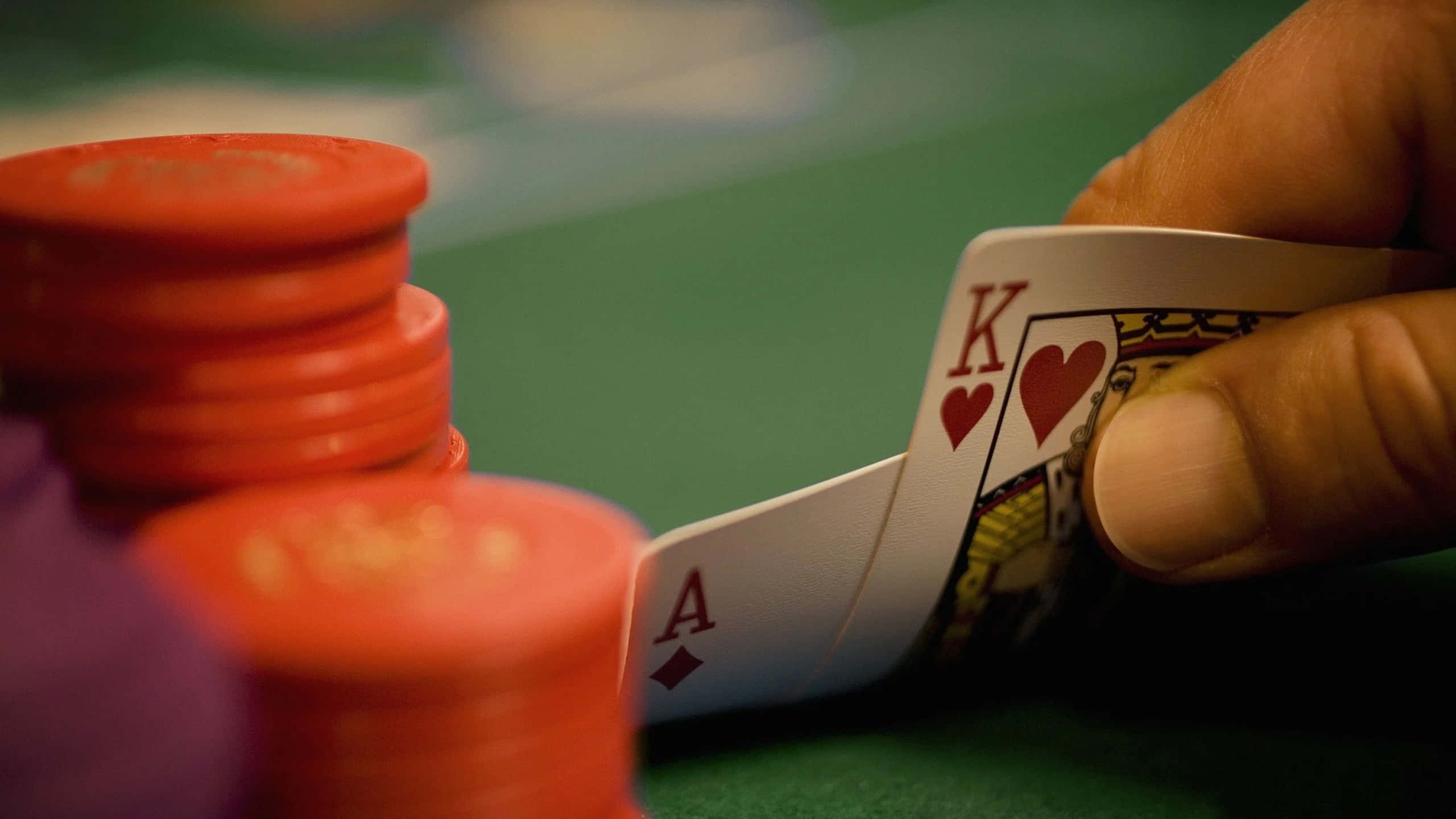 A Thrilling Poker Game At Luxurious Table Wallpaper