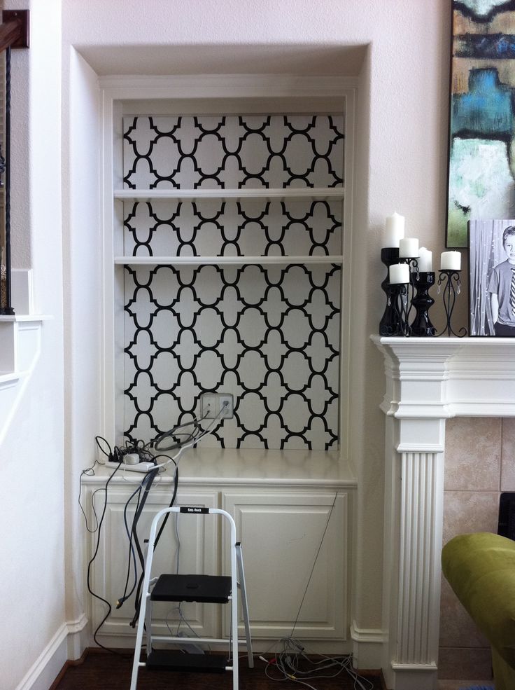 Why Wallpaper The Back Of A Bookshelf When You Can Wrap Fabric On