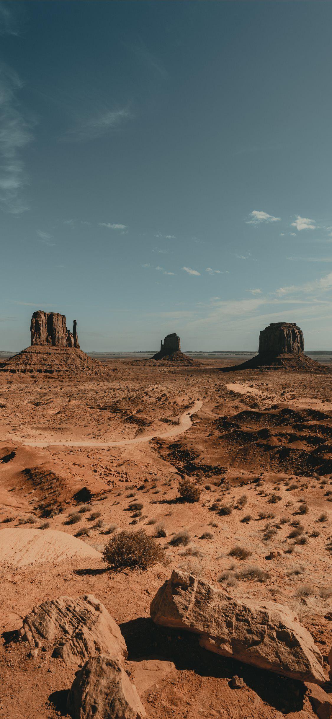 Brown Rock Formation Under White Clouds During Day Nature