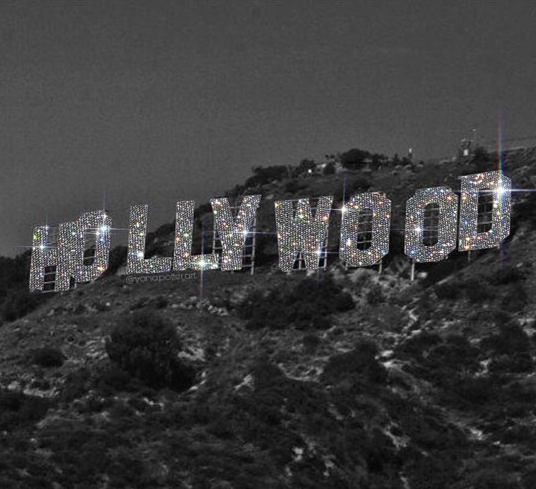 A glamorous, black and white image of the iconic Hollywood sign, encrusted with sparkling diamonds or rhinestones. Perfect for a Hollywood-themed wallpaper