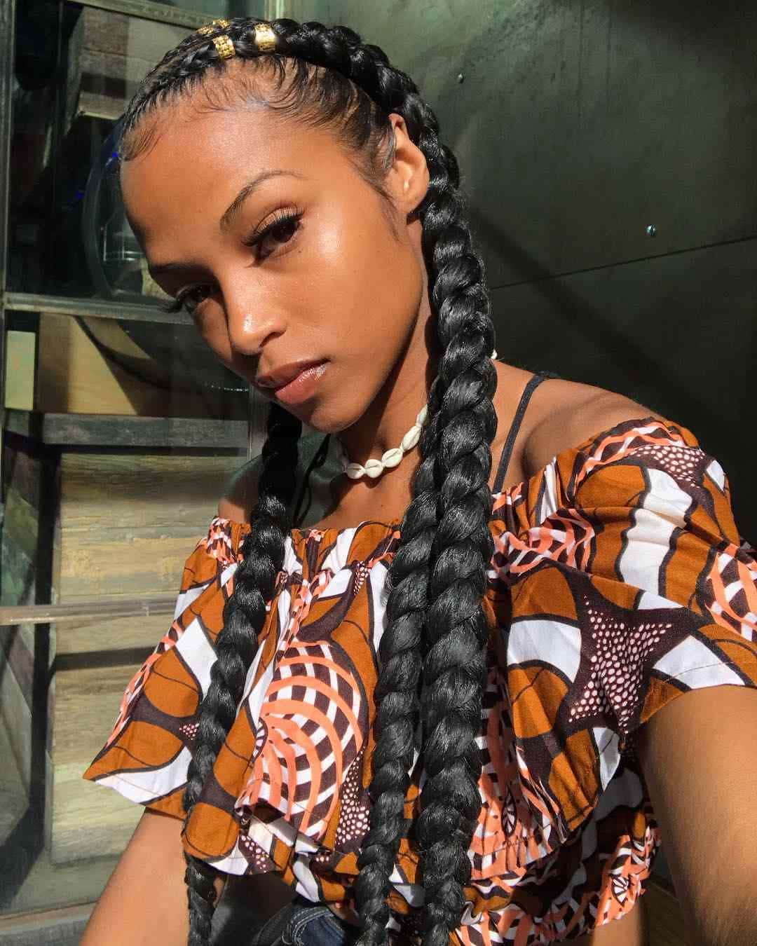 A Woman With Braids And Top Wallpaper
