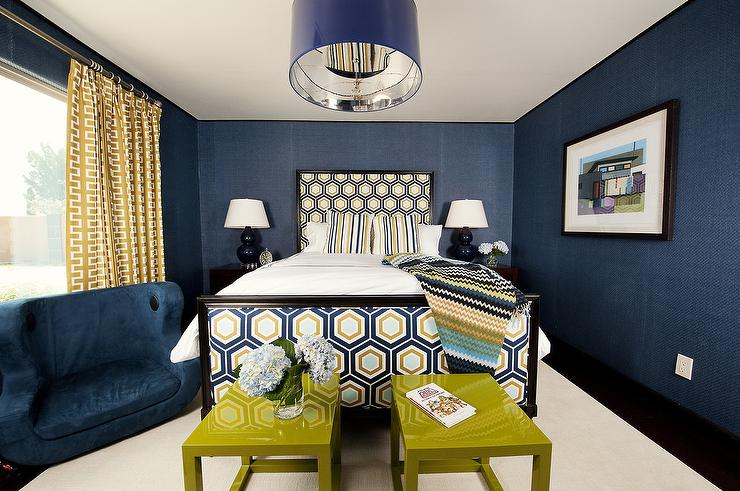 Yellow And Blue Bedroom Features Walls Clad In Navy Textured Wallpaper