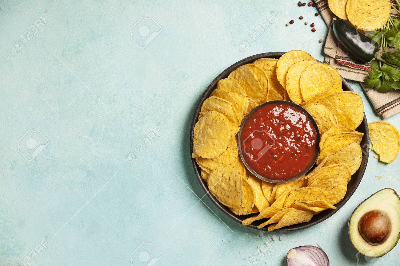 Mexican Nachos Chips With Salsa Sauce On Rustic Background