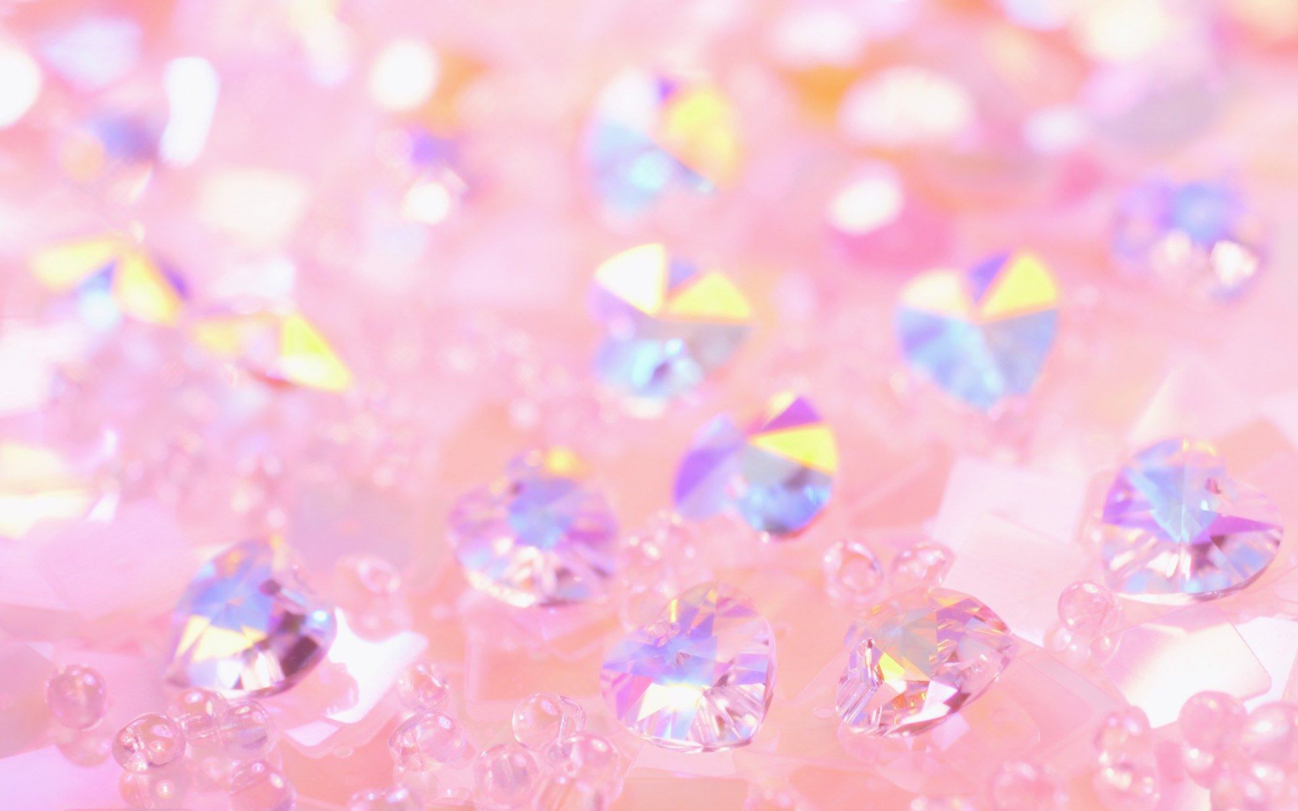 Close-up of shimmering pink glitter and heart-shaped crystals, creating a dreamy and romantic background